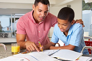 a father helping his son with homework