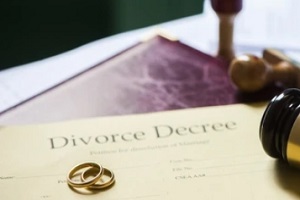 divorce agreement with rings and court gavel