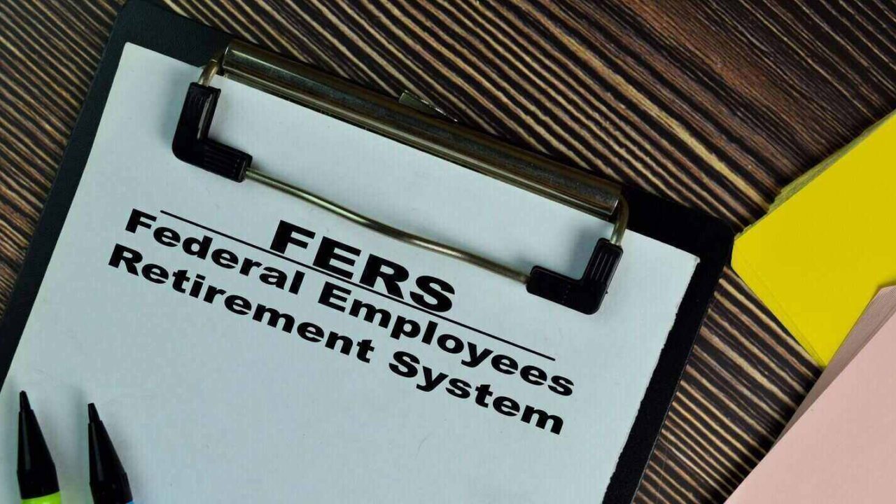 federal employees retirement system write on a paperwork isolated on wooden table