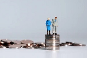 old couple dummies standing on coin stack