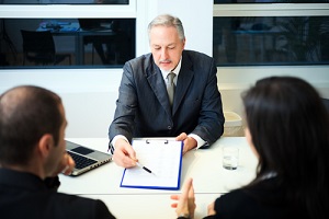 senior businessman showing a document