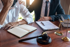 lawyer or judge consult or discussing contract papers with businessman client in office