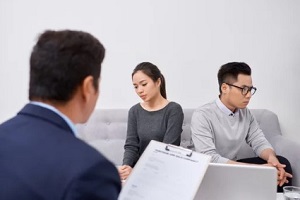 asian couple with divorce attorney
