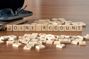 joint account on wooden blocks