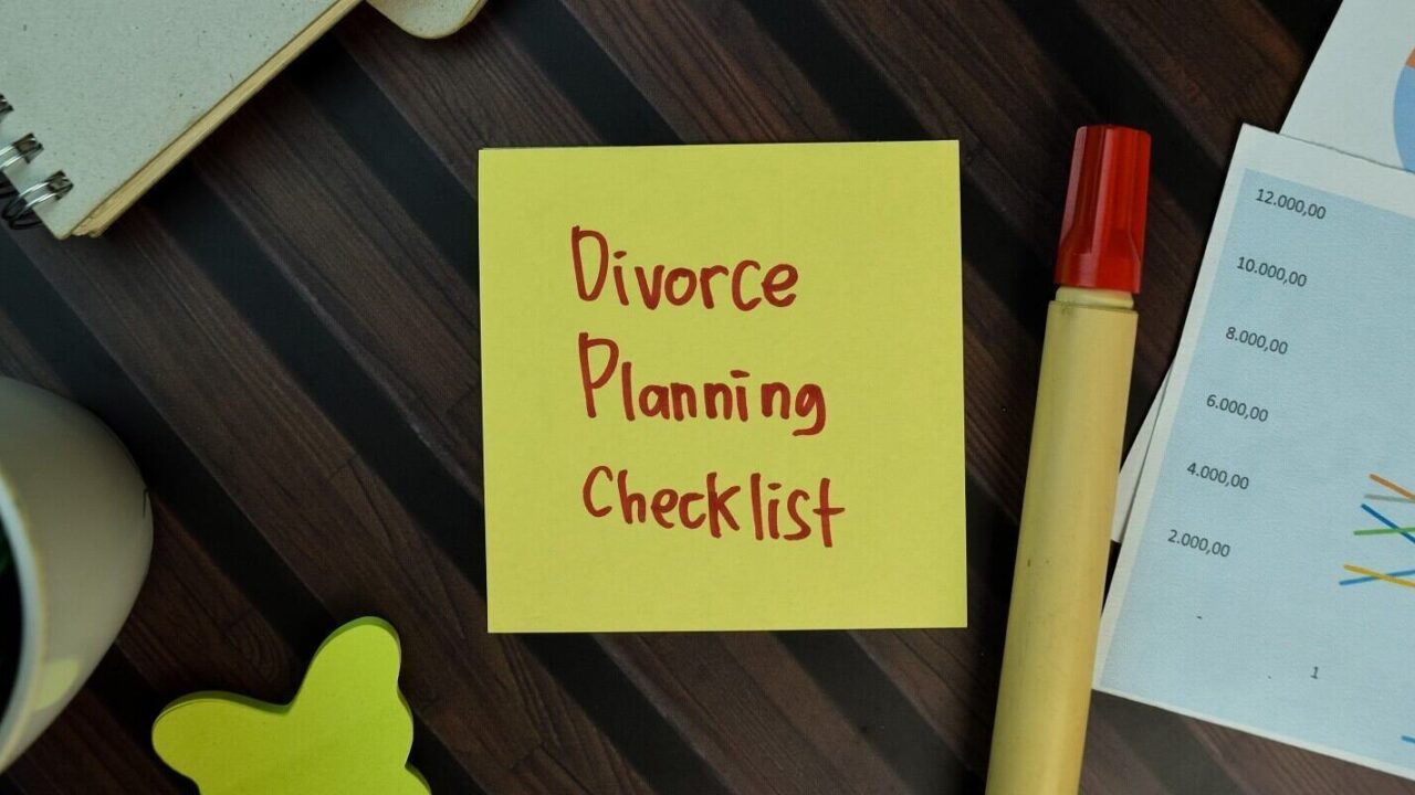 divorce planning checklist write on sticky notes isolated on wooden table