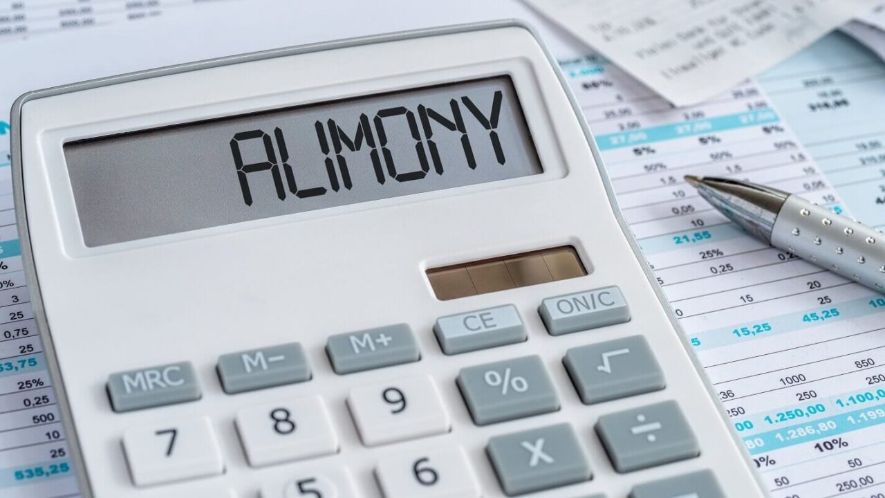 a calculator with the word Alimony on the display