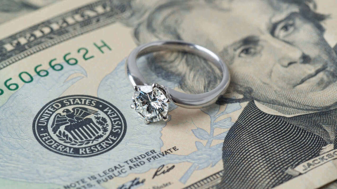 diamond ring on money