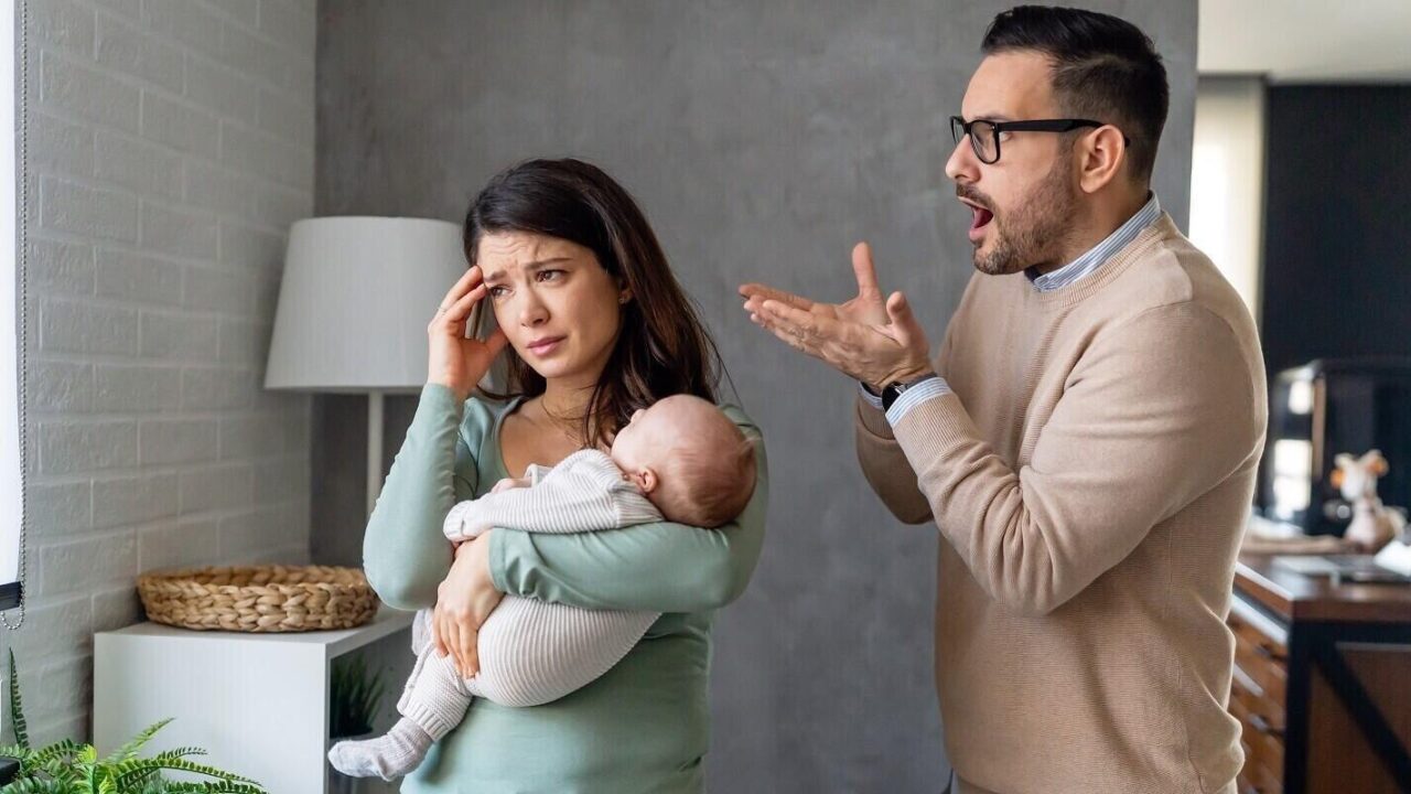 aggressive nervous man arguing with his wife who has postpartum depression